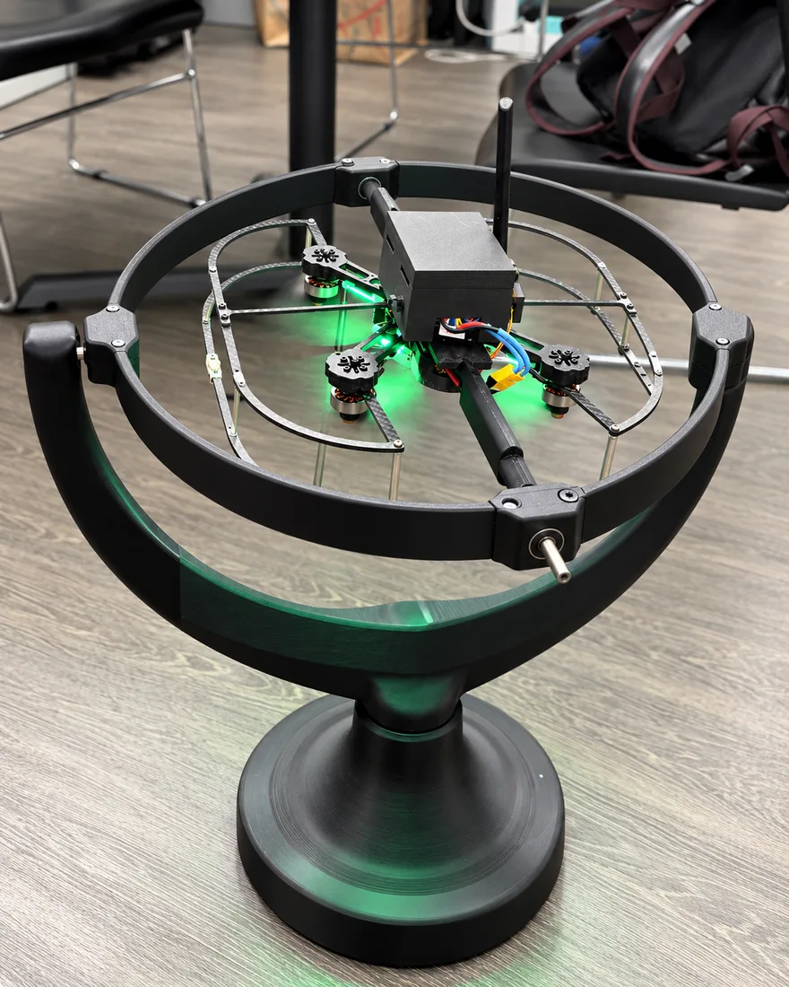 Drone mounted in a three-axis gimbal tuning rig